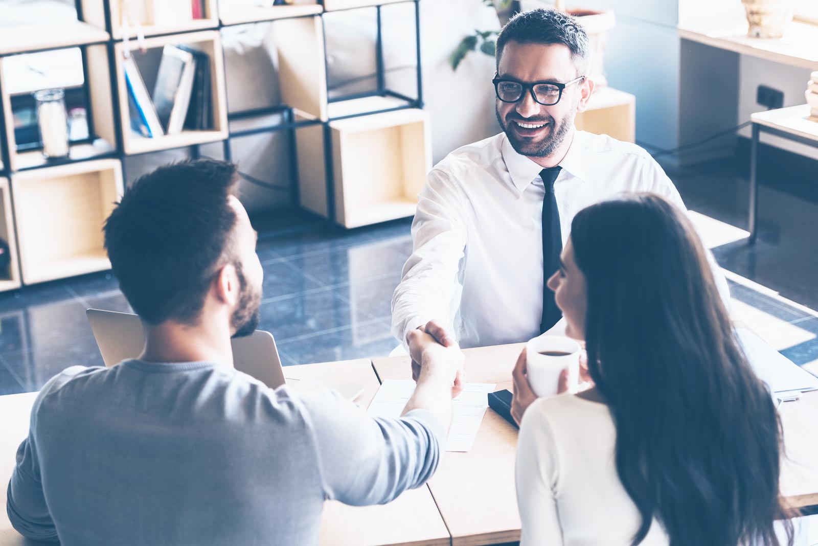 middle aged couple meeting with a financial advisor