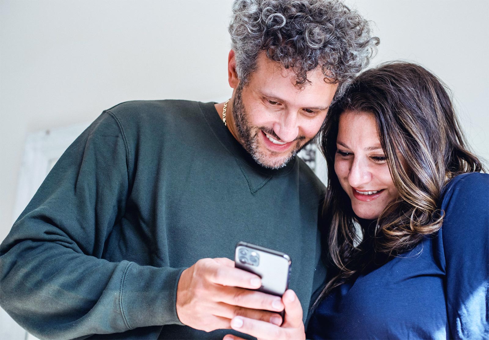 a-happy-matured-couple-looking-at-mobile-phone